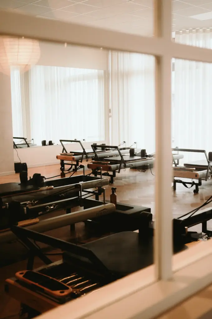 Boutique reformer Pilates studio interior with machines at Zen Zest Goes Netherlands