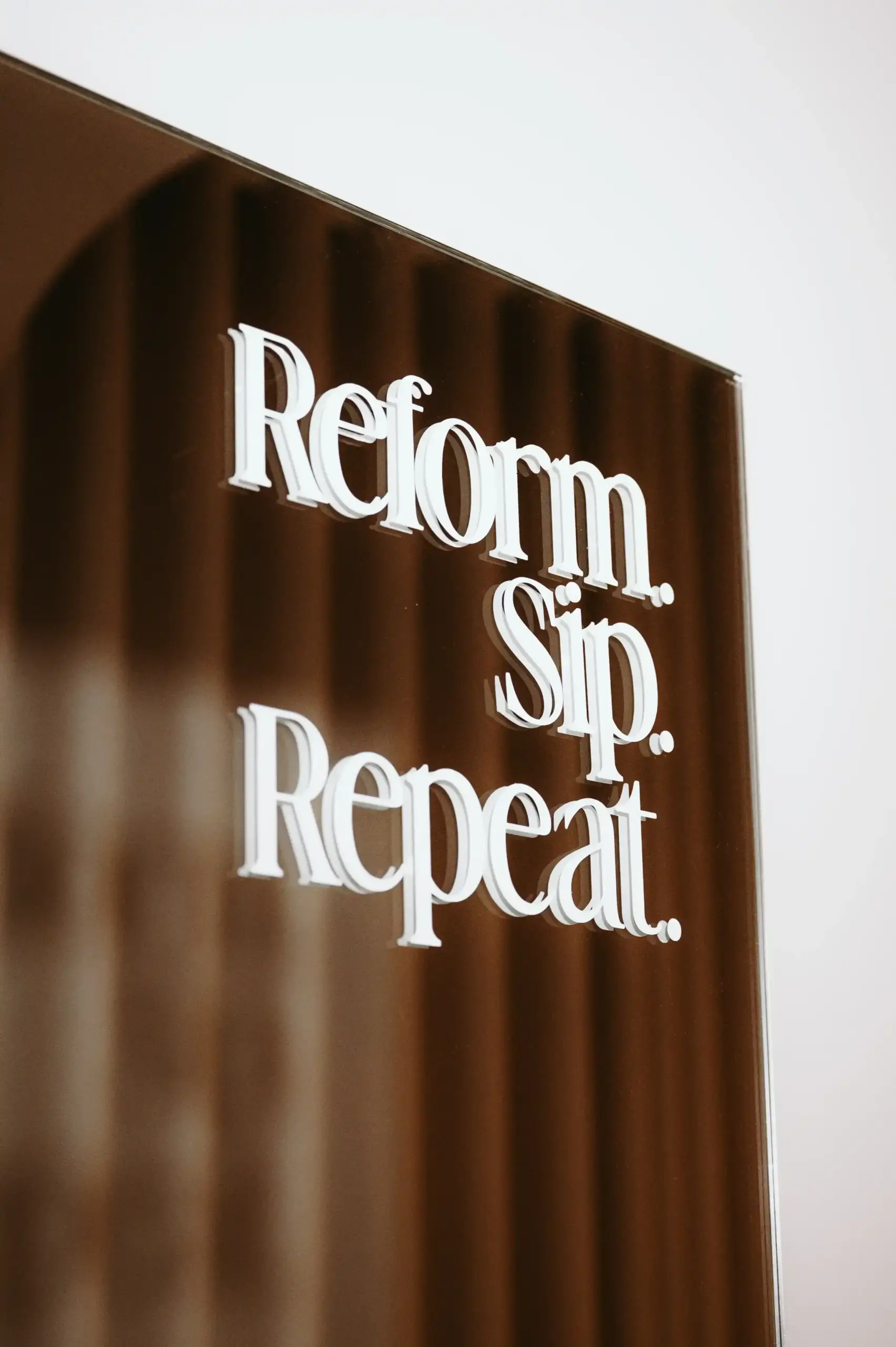 Reformer Pilates quote sign in boutique wellness studio Zen Zest Goes